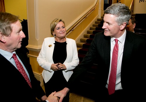 An Taoiseach, Enda Kenny TD, is greeted by Dr Adrian Howd, CEO of Malin with Deirdre Somers, CEO, Irish Stock Exchange at the launch of the Malin IPO at the Irish Stock Exchange