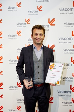 Mr Eli Keersmaekers CEO of Roland DG Benelux accepts the Viscom 'Best of 2012' award